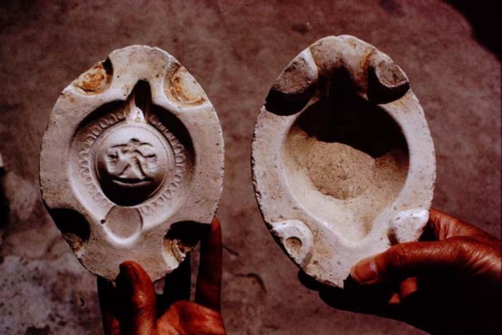 I.20.3 Pompeii. 1972. Interior of the mould that would have made the lamp with the small cupid. Photo by Stanley A. Jashemski.
Source: The Wilhelmina and Stanley A. Jashemski archive in the University of Maryland Library, Special Collections (See collection page) and made available under the Creative Commons Attribution-Non Commercial License v.4. See Licence and use details. J72f0118