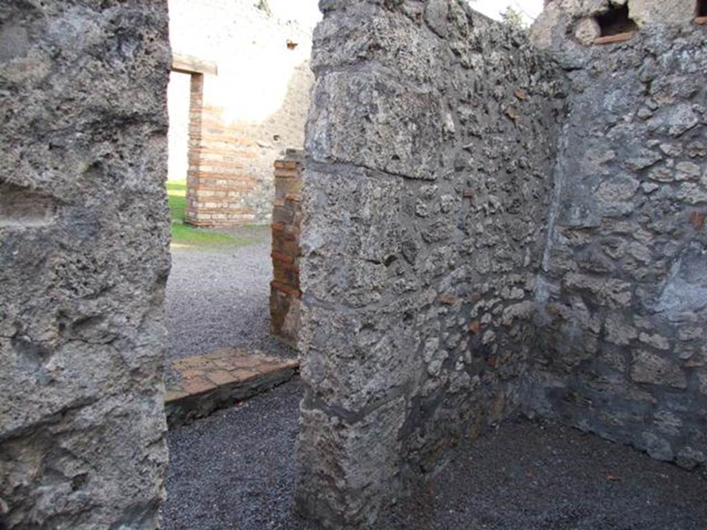 II.1.3. Small cubiculum. East wall looking through doorway into corridor and doorway to II.1.4.