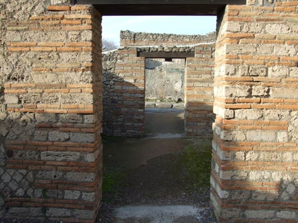 II.1.4 Pompeii. December 2007. Looking north across middle room to entrance room on Via dell’ Abbondanza.