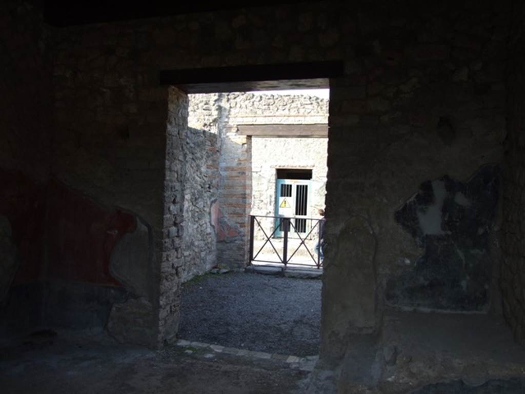 II.1.5 Pompeii. Large Taberna. Looking north through doorway of rear room towards entrance on Via dell' Abbondanza.