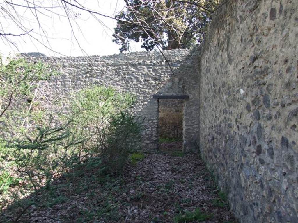 II.1.12 Pompeii. March 2009. Looking east on south side of peristyle garden. Doorway into room in south east corner.