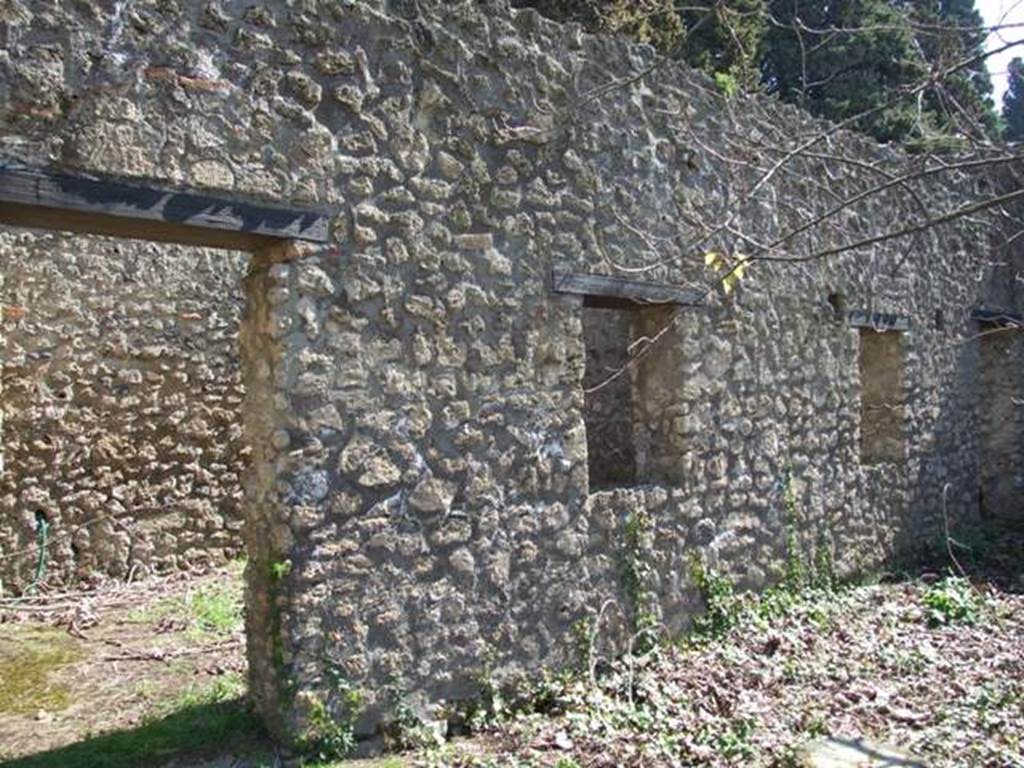 II.1.12 Pompeii. March 2009. Doorway and windows of rooms on the east side of the peristyle.
