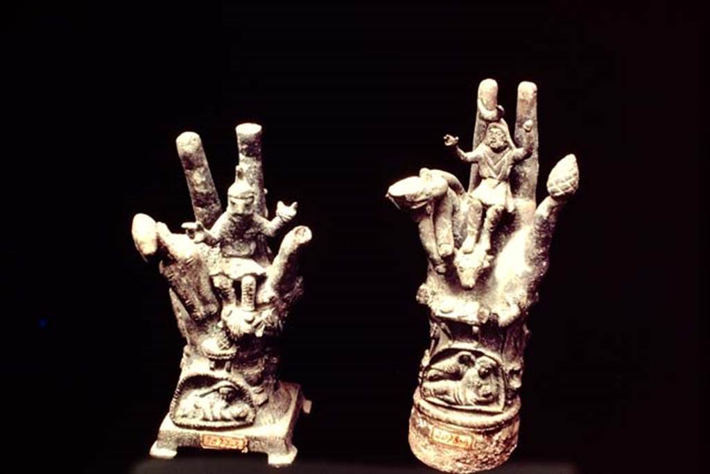 II.1.12 Pompeii, 1978. Cult objects of two bronze hands. Photo by Stanley A. Jashemski.
Source: The Wilhelmina and Stanley A. Jashemski archive in the University of Maryland Library, Special Collections (See collection page) and made available under the Creative Commons Attribution-Non Commercial License v.4. See Licence and use details. J78f0414