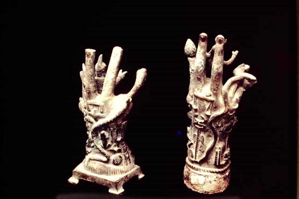 II.1.12 Pompeii, 1978. Cult objects, the reverse of the two bronze hands. Photo by Stanley A. Jashemski.
Source: The Wilhelmina and Stanley A. Jashemski archive in the University of Maryland Library, Special Collections (See collection page) and made available under the Creative Commons Attribution-Non Commercial License v.4. See Licence and use details. J78f0418