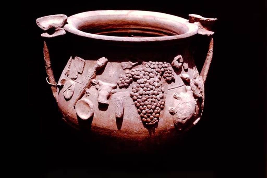 II.1.12 Pompeii, 1978. Terracotta vase found with other cult objects. Photo by Stanley A. Jashemski.
Source: The Wilhelmina and Stanley A. Jashemski archive in the University of Maryland Library, Special Collections (See collection page) and made available under the Creative Commons Attribution-Non Commercial License v.4. See Licence and use details. J78f0591