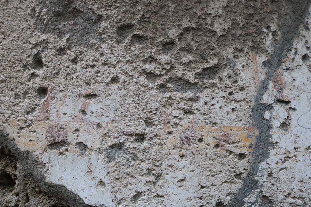 II.1.13 Pompeii. December 2018.
Detail from painted plaster on exterior wall, on north side (left) of entrance. Photo courtesy of Aude Durand.