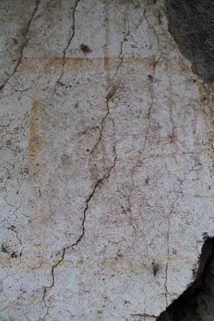 II.1.13 Pompeii. December 2018.
Detail from painted plaster on exterior wall, on north side (left) of entrance. Photo courtesy of Aude Durand.