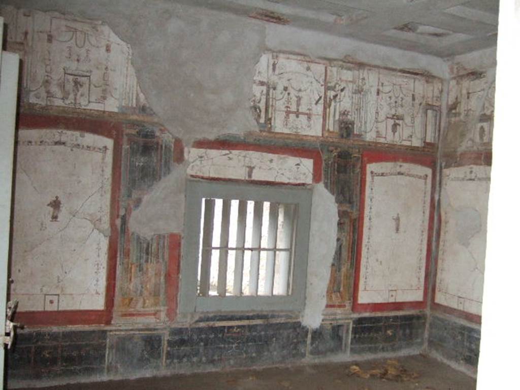 II.2.2 Pompeii. December 2005. Room “f”, south wall of oecus. The painting of the priest of Isis was found on the west side of the south wall. Underneath it was written the inscription AMISUSIUS LoreiUS TIBURTinus. According to Warscher (1930) it was supposed that he was the owner of the house. See Warscher, T., 1930. Pompeii in three hours. Rome, (p.134) According to Varone and Stefani, under the figure was CIL IV 7534, which is no longer readable. See Varone, A. and Stefani, G., 2009. Titulorum Pictorum Pompeianorum, Rome: L’erma di Bretschneider, (p.198 with photo)