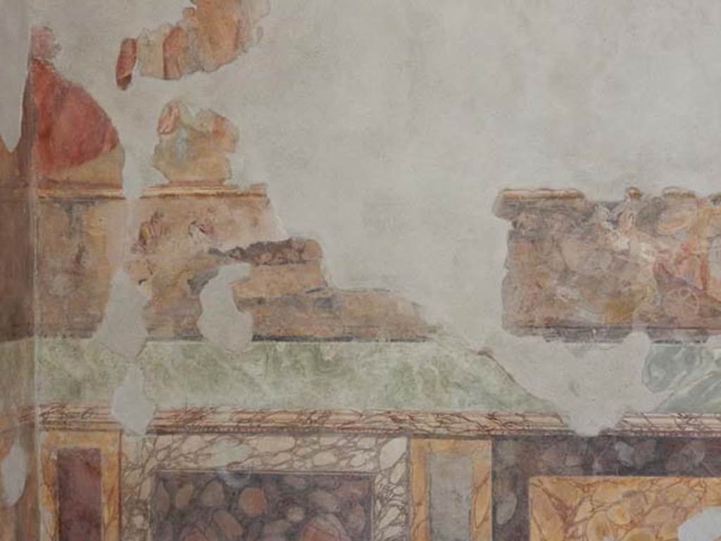 II.2.2 Pompeii. May 2016. Room “h”, west end of north wall.
Iliad frieze, possibly the Body of Sarpedon, above the marbled zoccolo.
Photo courtesy of Buzz Ferebee.