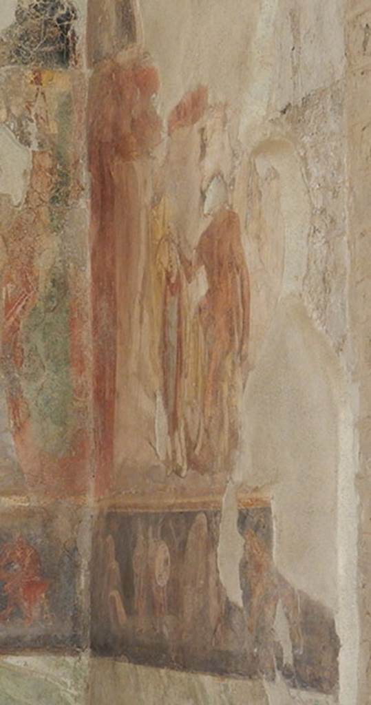 II.2.2 Pompeii. May 2016. Room “h”, south wall in south-east corner.
Large frieze depicting Heracles seated on a rock and placing a Phrygian cap on the head of the young Priam, investing him as the new King of Troy.
Priam holds a sceptre in his left hand.
Photo courtesy of Buzz Ferebee.