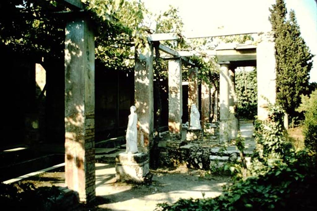 II.2.2 Pompeii. 1957. Room "i", looking east across upper garden area. Jashemski describes the two surviving statues as, one of Polyhymnia (SAP 2917) and the second of Mnemosyne (SAP 2909).
The names on her photographs however are reversed.
See Jashemski, W. F., 1993. The Gardens of Pompeii, Volume II: Appendices. New York: Caratzas. (p. 80-1, Figs 84-85).
Photo by Stanley A. Jashemski.
Source: The Wilhelmina and Stanley A. Jashemski archive in the University of Maryland Library, Special Collections (See collection page) and made available under the Creative Commons Attribution-Non Commercial License v.4. See Licence and use details.
J57f0472