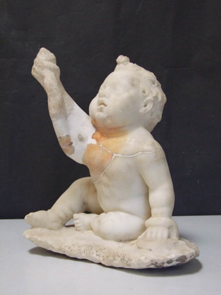 II.2.2 Pompeii. March 2009. White marble statuette of a young Hercules strangling a snake. Found on the north side of the upper euripus in the garden in 1920. SAP inventory number: 2932.