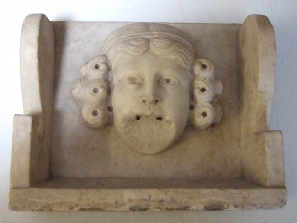 II.2.2 Pompeii. March 2009. Room “i”. White marble Mask of a woman. Found on the south side of the upper euripus in the garden in 1920. SAP inventory number: 2928.