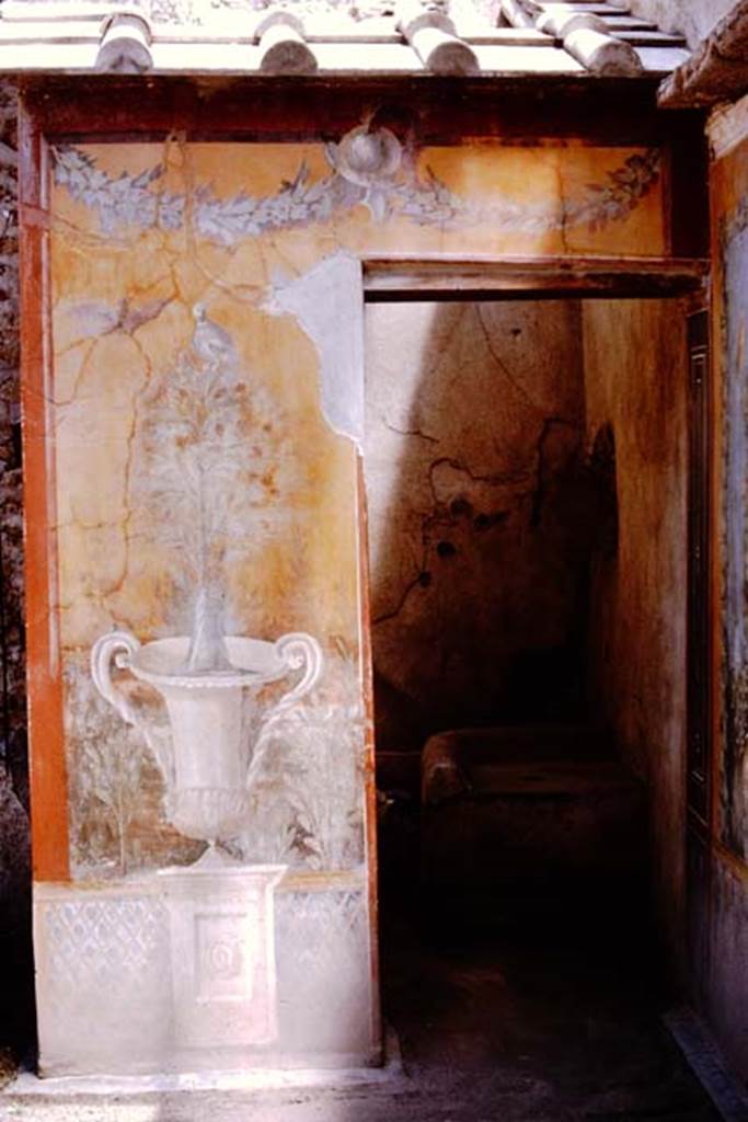II.3.3 Pompeii. 1964. Room 17, exterior west side of sacellum showing wall painting of crater, fountain and tree. Photo by Stanley A. Jashemski.
Source: The Wilhelmina and Stanley A. Jashemski archive in the University of Maryland Library, Special Collections (See collection page) and made available under the Creative Commons Attribution-Non Commercial License v.4. See Licence and use details.
J64f1708

