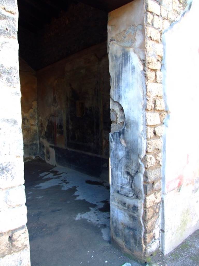 II.3.3 Pompeii. March 2009. Doorway of Room 6, North side.