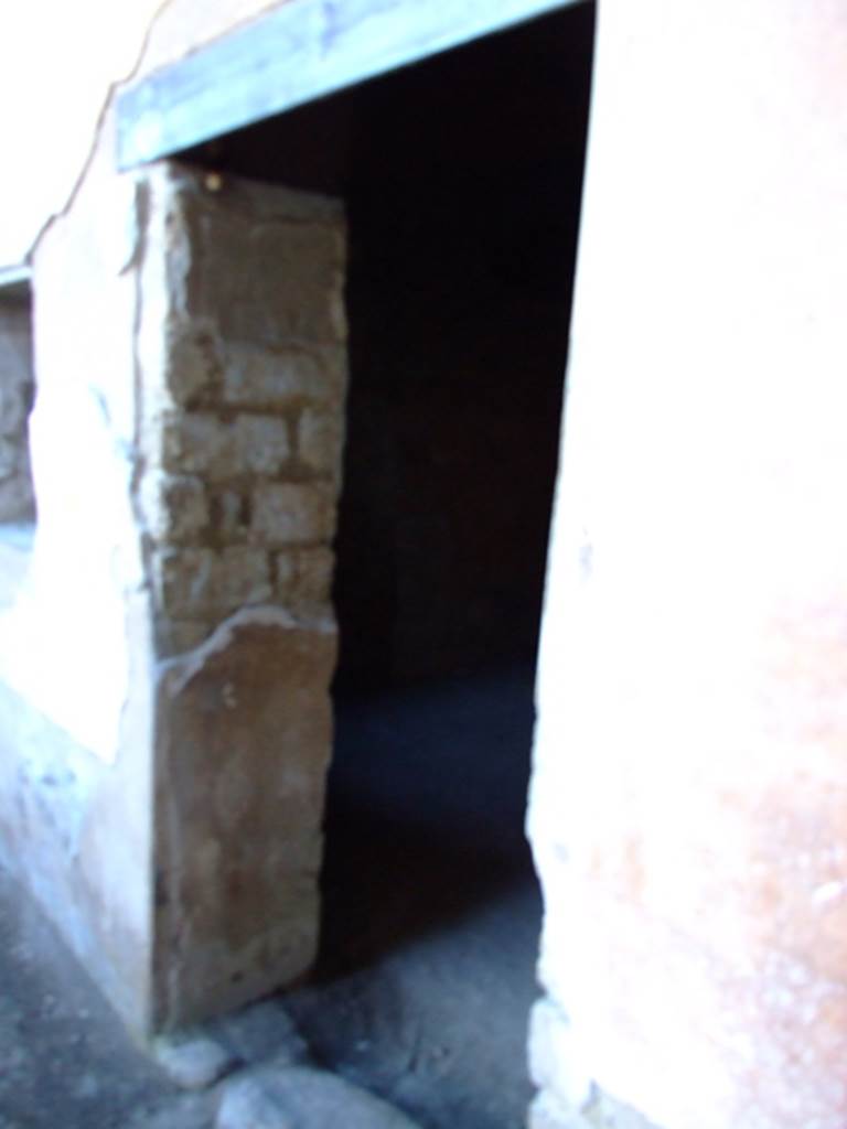 II.3.3 Pompeii. March 2009. Doorway to Room 13.