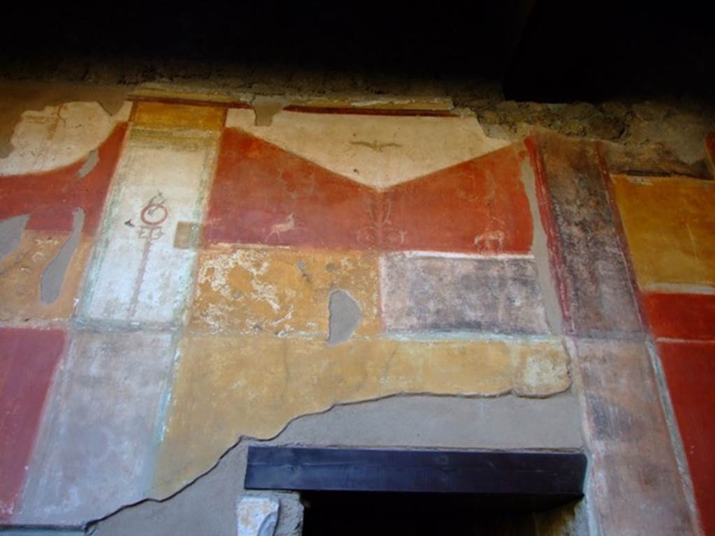 II.3.3 Pompeii. March 2009. Room 11, West Portico. Painted decoration above Doorway to Room 13.