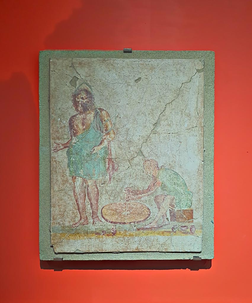 II.3.8/9 Pompeii. March 2024. Fresco of Vulcan and the potter.
On display in exhibition in Palaestra, entitled - “L’altra Pompei, vite comuni all’ombra del Vesuvio”.
Photo courtesy of Giuseppe Ciaramella.