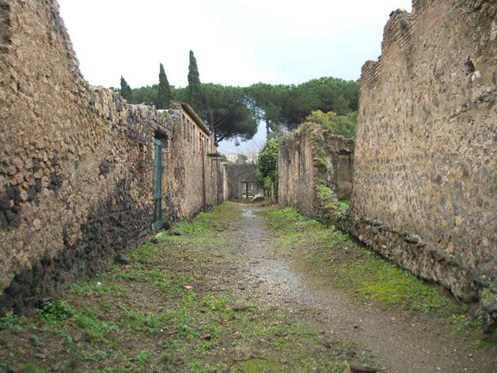 II.4.1 Pompeii. December 2006. Roadway looking south, with II.3.4, on right.