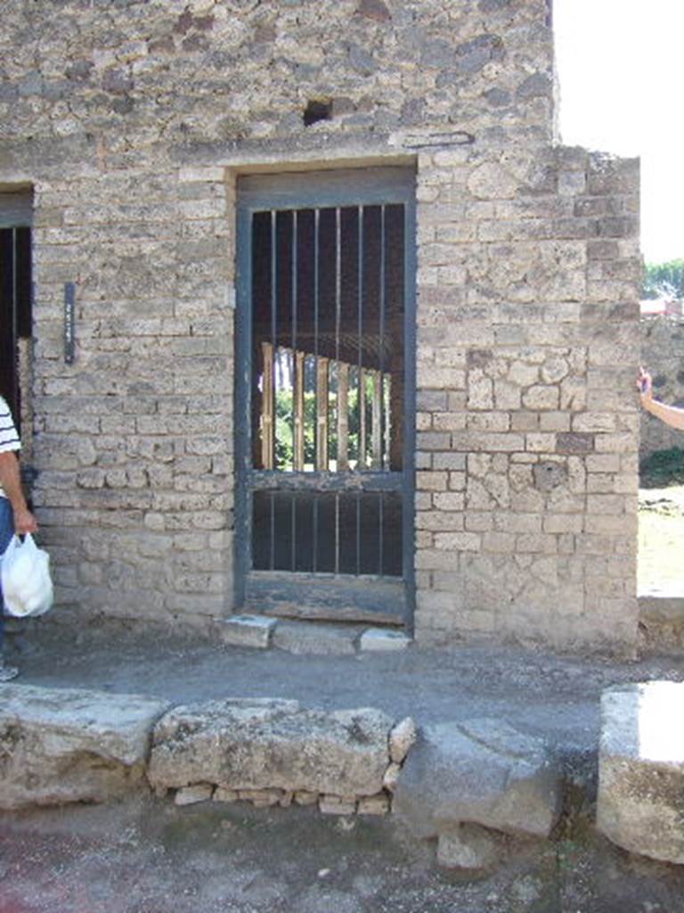 II.4.2 Pompeii. September 2005. Doorway to steps leading to upper floor. According to Cooley, the graffito CIL IV 1136 was found on the wall here. According to Della Corte, it was found on the west (right) side of II.4.6, so see II.4.6
See Cooley, A. and M.G.L., 2004. Pompeii : A Sourcebook. London : Routledge. (p.171)
See Della Corte, M., 1965. Case ed Abitanti di Pompei. Napoli: Fausto Fiorentino. (p.390)