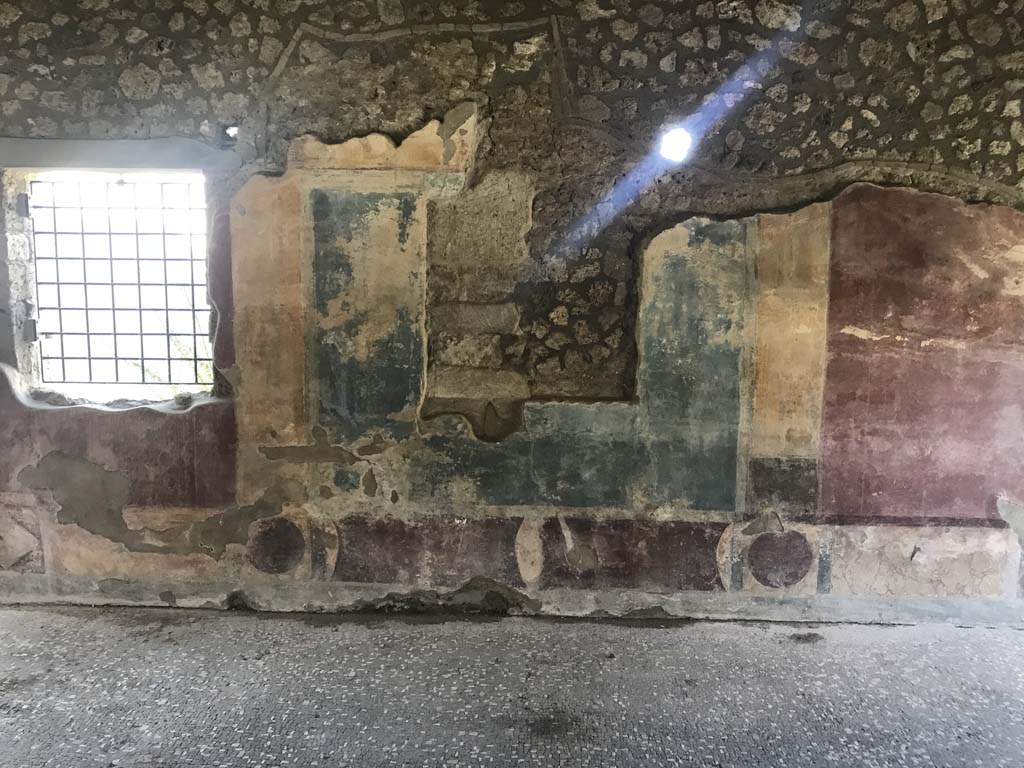 II.4.3 Pompeii. April 2019. Looking towards west wall of atrium. Photo courtesy of Rick Bauer.
Above the south end of the blue panel, a part of the Forum Frieze can still be seen.