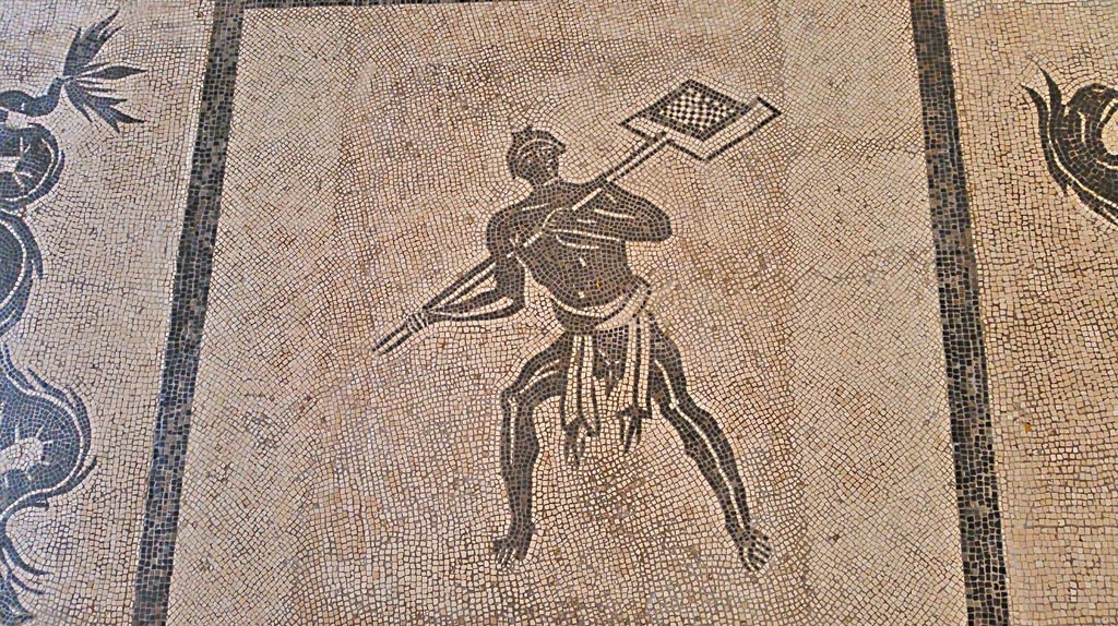 II.4.6 Pompeii. September 2017.
Black and white mosaic from centre of floor showing a furnaceman and a marine scene set in floor of Naples Museum.
Photo courtesy of Giuseppe Ciaramella.