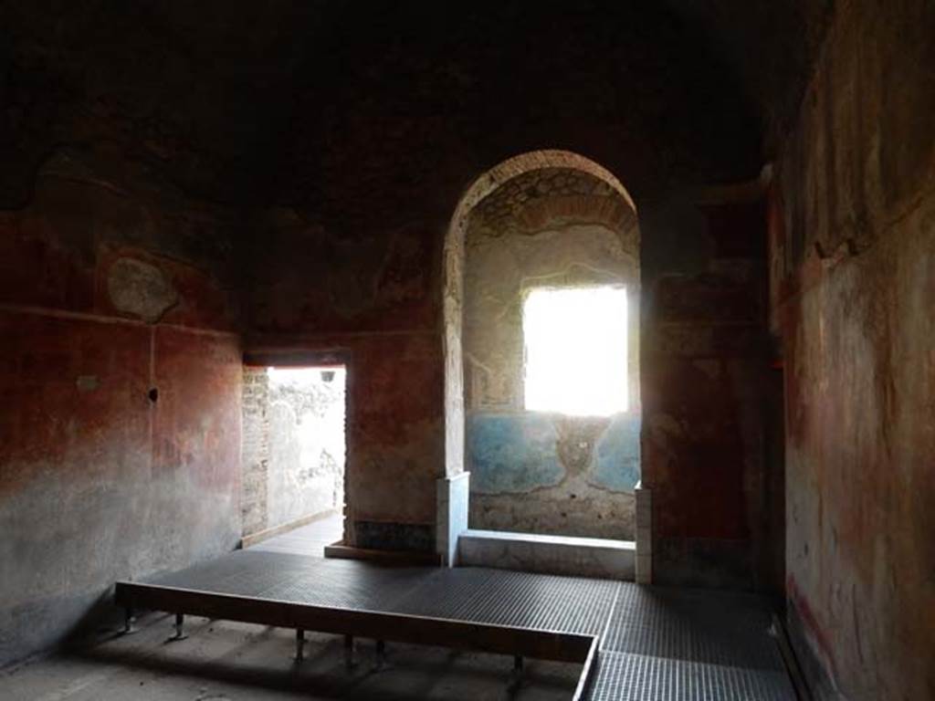 II.4.6 Pompeii. May 2017.
Frigidarium/apodyterium, looking towards south wall, with doorway to garden area near latrine, centre left.
Looking south towards the basin/pool with three windows, centre right. Photo courtesy of Buzz Ferebee.