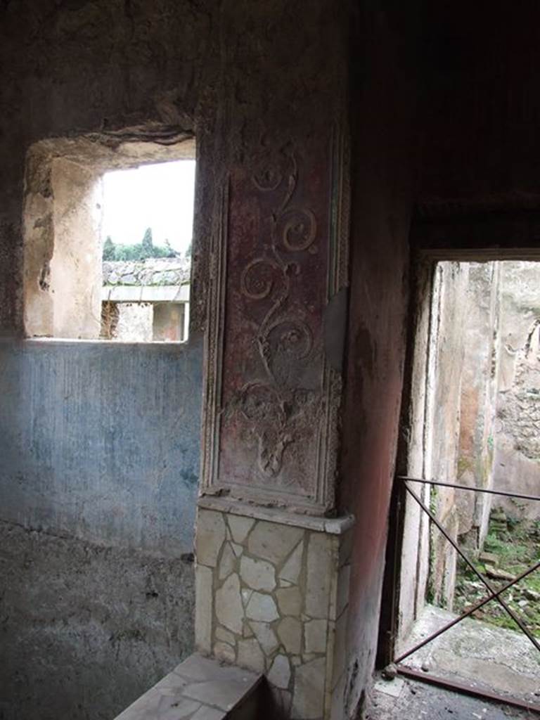 II.4.6 Pompeii. December 2006. Frigidarium/apodyterium, detail of west side, and doorway to tepidarium or warm bath-room with remains of a black and white mosaic threshold.