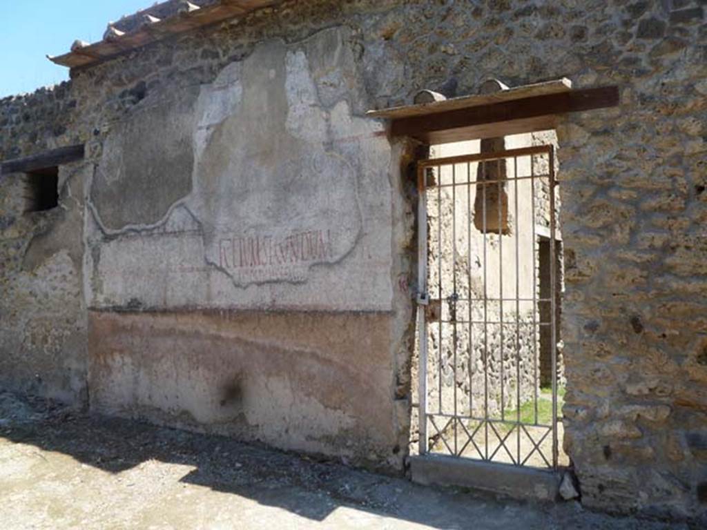 II.4.10 Pompeii. May 2011.
Exterior west wall in Vicolo di Giulia Felice, on north side of doorway, showing multiple layers of graffiti or painted plaster.
L. Ceium Secundum aed… can be clearly read. Photo courtesy of Michael Binns.