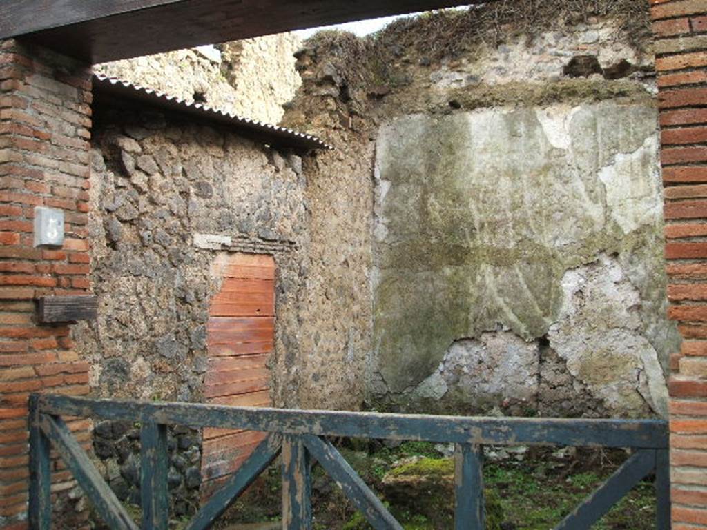 II.4.5 Pompeii. December 2004. Shop entrance doorway, looking south-east.