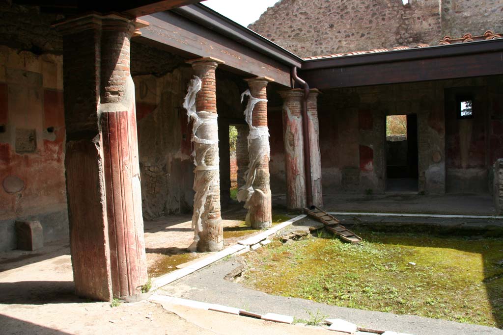 II.4.6 Pompeii. April 2013. Looking towards the east side and south-east corner of the portico, from entrance doorway.
Photo courtesy of Klaus Heese.