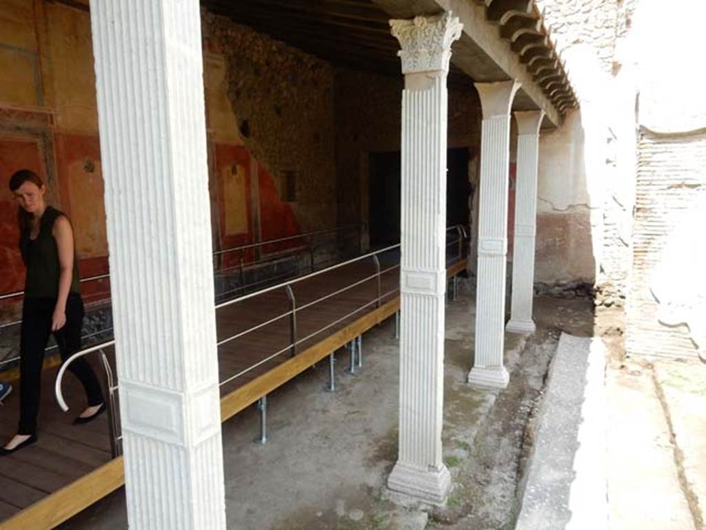 II.4.6 Pompeii. May 2016. Looking north-west towards north end of west portico and doorway into II.4.2/3.
Photo courtesy of Buzz Ferebee.