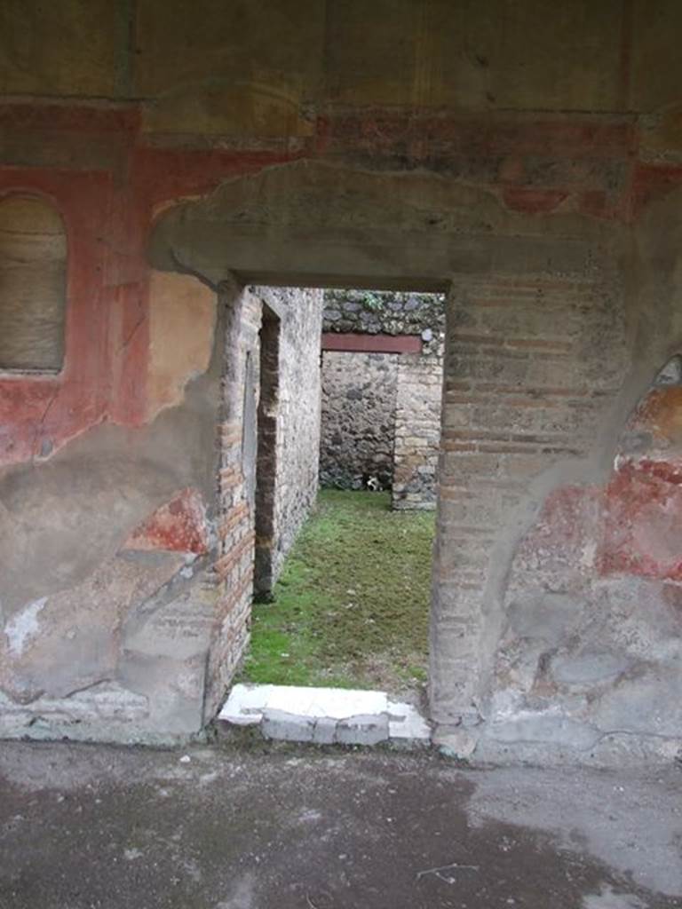 II.4.6 Pompeii. December 2006. Doorway to room with two doorways to a corridor in its west wall. In the south wall, on the left, is a doorway leading into the room on the north side of summer triclinium.