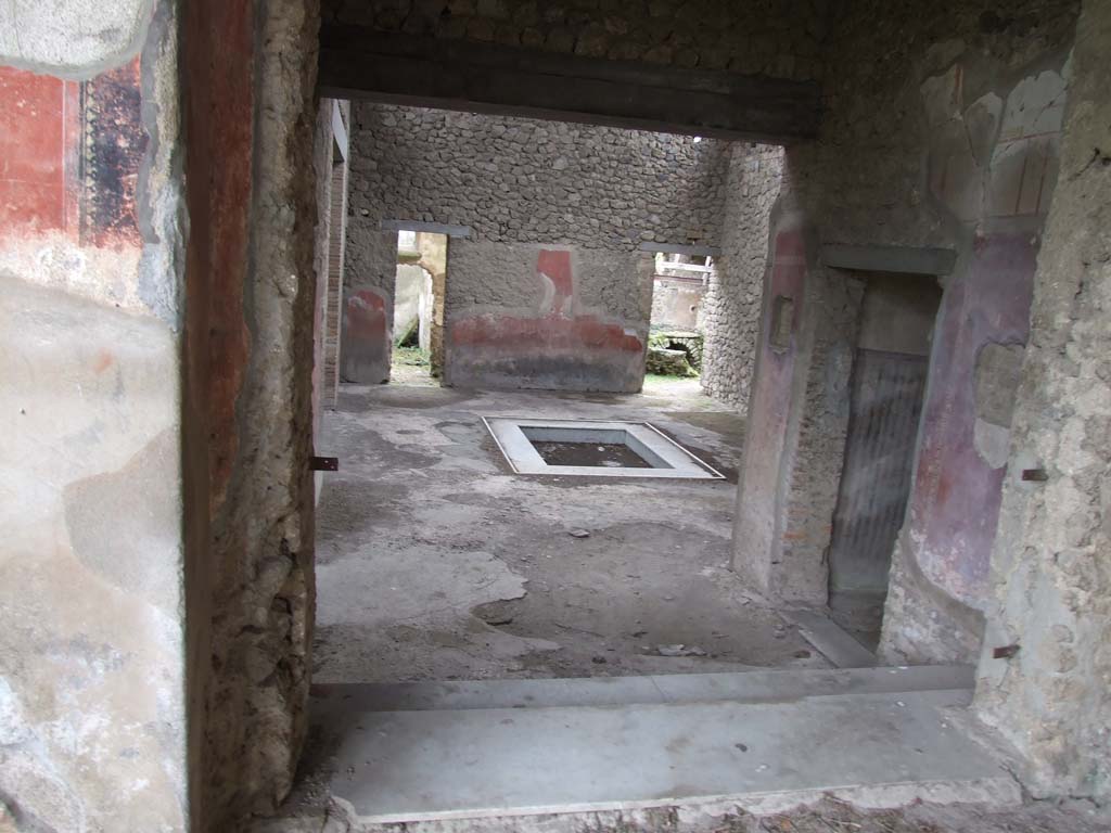 II.4.6 Pompeii. December 2006. Looking south into atrium of II.4.10, from top of steps at south end of portico.
To view these rooms, see II.4.10.