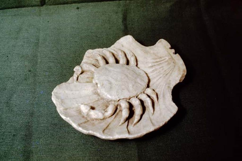 II.4.6 Pompeii, 1978. Small fountain statue of a crab, found in garden. Photo by Stanley A. Jashemski.
Source: The Wilhelmina and Stanley A. Jashemski archive in the University of Maryland Library, Special Collections (See collection page) and made available under the Creative Commons Attribution-Non Commercial License v.4. See Licence and use details. J78f0098