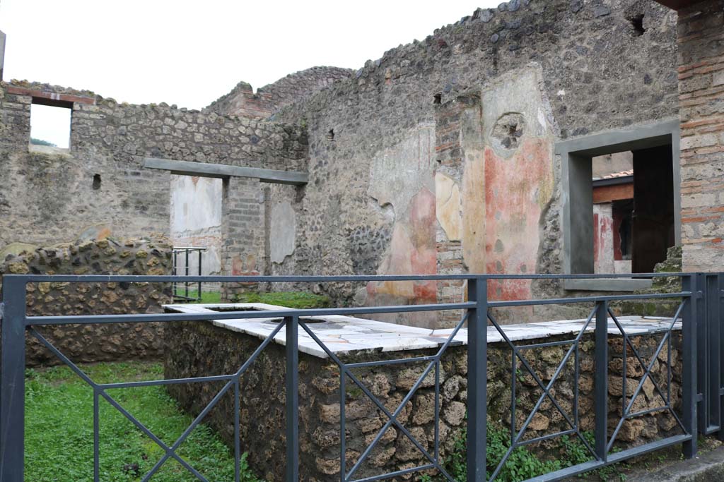 II.4.7 Pompeii. December 2018.
Looking south-west across bar-room from entrance on Via dell’Abbondanza. Photo courtesy of Aude Durand.
