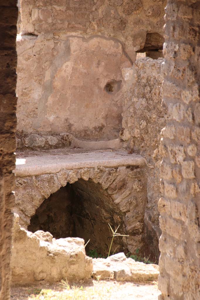 II.4.10 Pompeii. September 2019. Looking towards hearth against south wall of kitchen.
Photo courtesy of Klaus Heese.