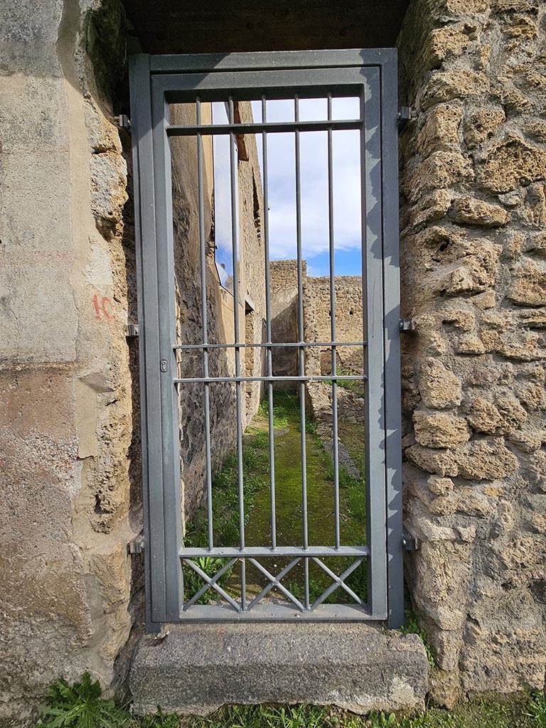 II.4.10 Pompeii. November 2024.
Looking east towards entrance doorway. Photo courtesy of Annette Haug.