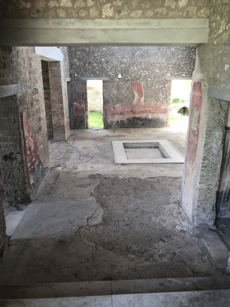 II.4.10 Pompeii. April 2019. Looking south across atrium, from west portico of II.4.6. Photo courtesy of Rick Bauer.