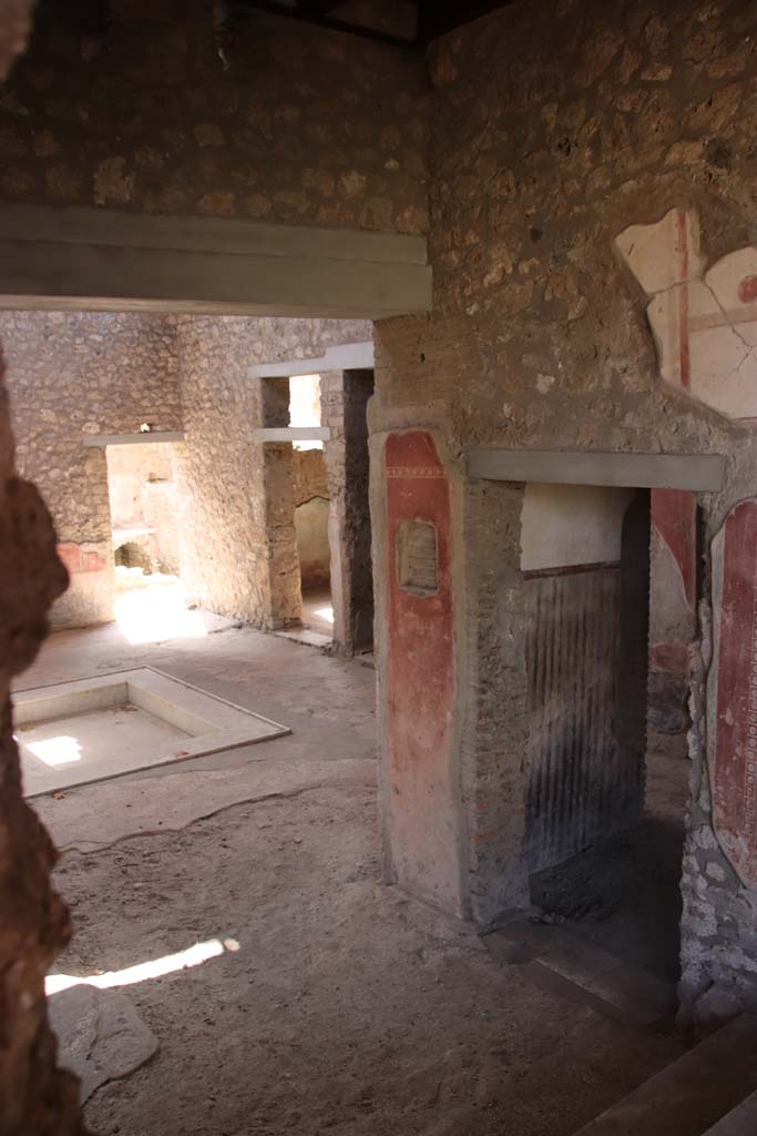 II.4.10 Pompeii. September 2019. Looking towards rooms on west side of atrium.
Photo courtesy of Klaus Heese.