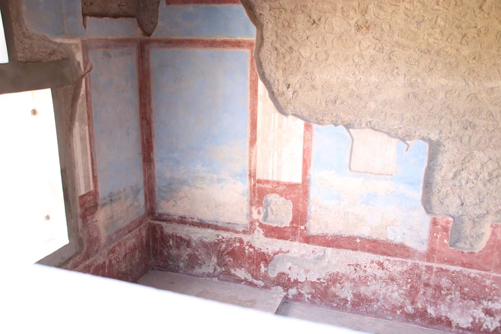 II.4.10 Pompeii. September 2019.Looking towards east wall with window, south-east corner and south wall of biclinium.
Photo courtesy of Klaus Heese.