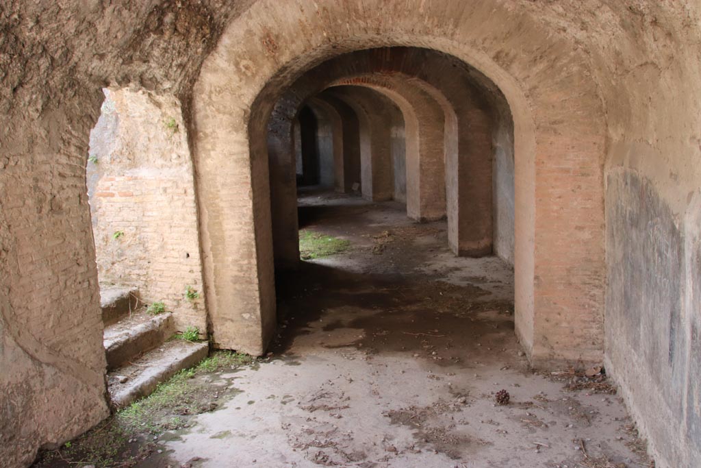 II.6 Pompeii. October 2022.
West corridor under Amphitheatre, looking south-west from north entrance corridor. Photo courtesy of Klaus Heese