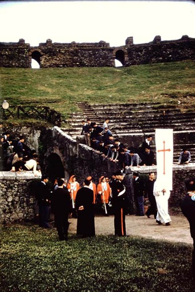 II.6 Pompeii. 1961.South end of ampitheatre, man in white with banner leading the parade for the performance of the mystery play. Photo by Stanley A. Jashemski.
Source: The Wilhelmina and Stanley A. Jashemski archive in the University of Maryland Library, Special Collections (See collection page) and made available under the Creative Commons Attribution-Non Commercial License v.4. See Licence and use details.
J61f0275
