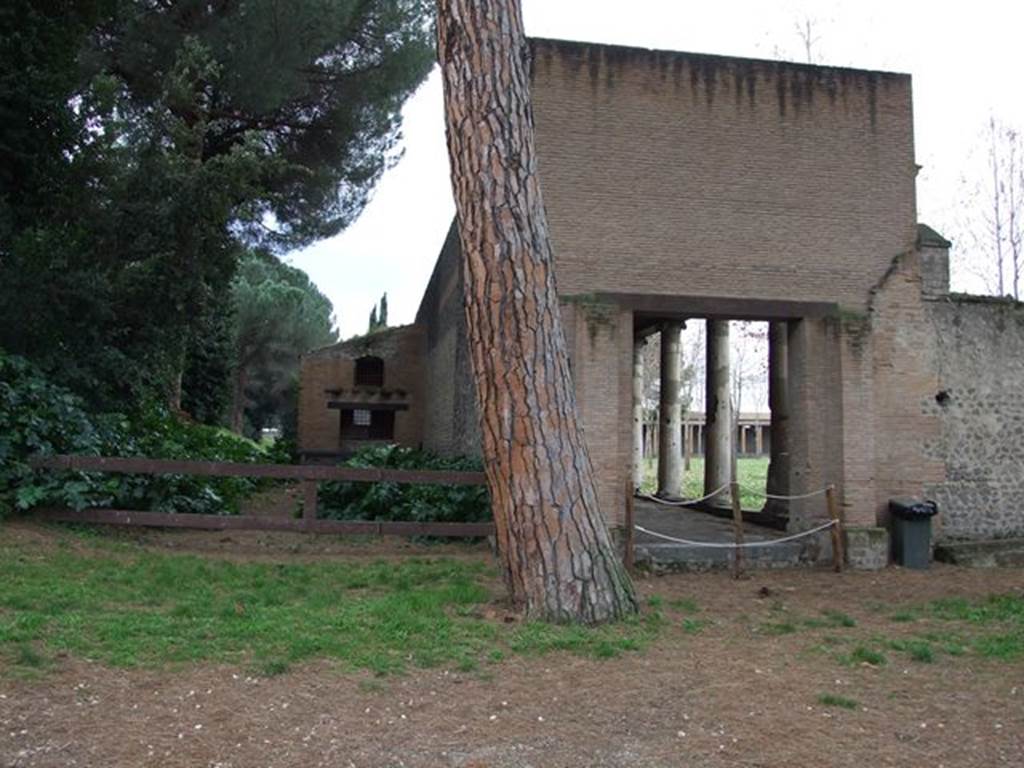 II.7.1 Pompeii. Palaestra. December 2006. Entrance.
According to Garcia y Garcia,
Many bombs, at least 10, fell in the internal and external areas, damaging the palaestra excavated between 1935-39.
The first bombs fell during the night incursion of 20th September 1943; the others fell during the following days between 21st to the 26th September 1943.
One of the most beautiful of the plaster-casts made was of a man covering his face with his hands in a manner of true abandonment and resignation.
He was found at the eastern extremity of the southern portico of the Palestra, and shown by Maiuri in the Pompeii Antiquarium, replaced in 1947 by a restoration that had altered notably the original form. (P.195 and note 78).
See Garcia y Garcia, L., 2006. Danni di guerra a Pompei. Rome: L’Erma di Bretschneider.