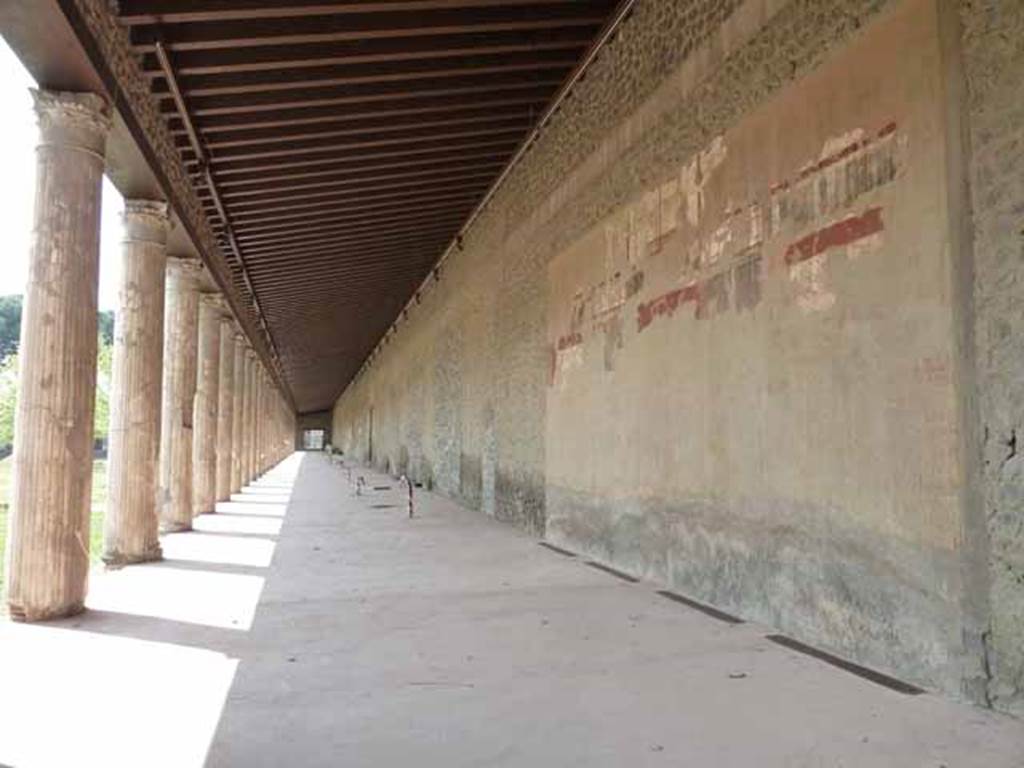 II.7.5 Pompeii. Palaestra. May 2010. North portico with remains of painted wall plaster.