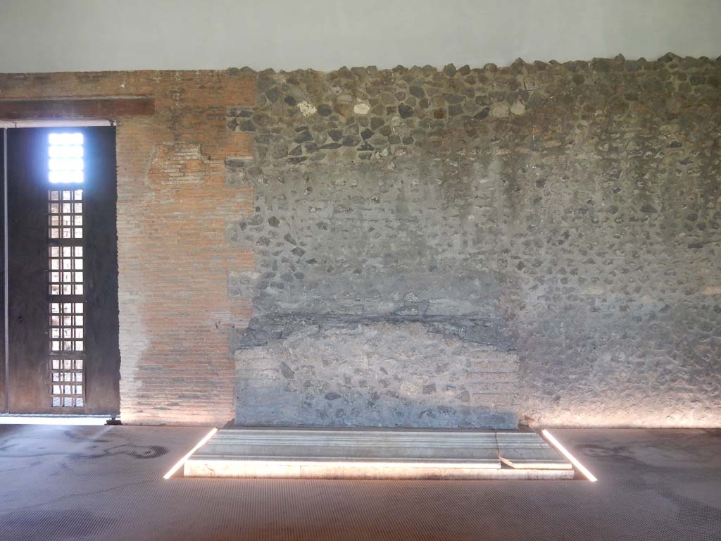 II.7 Pompeii. June 2019. Looking towards altar against west wall, and doorway at II.7.9a leading west.
Photo courtesy of Buzz Ferebee.