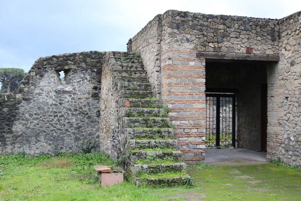 II.8.1 Pompeii. December 2018.
Looking west in garden area, towards stairs built against the south wall with the oven. Photo courtesy of Aude Durand.