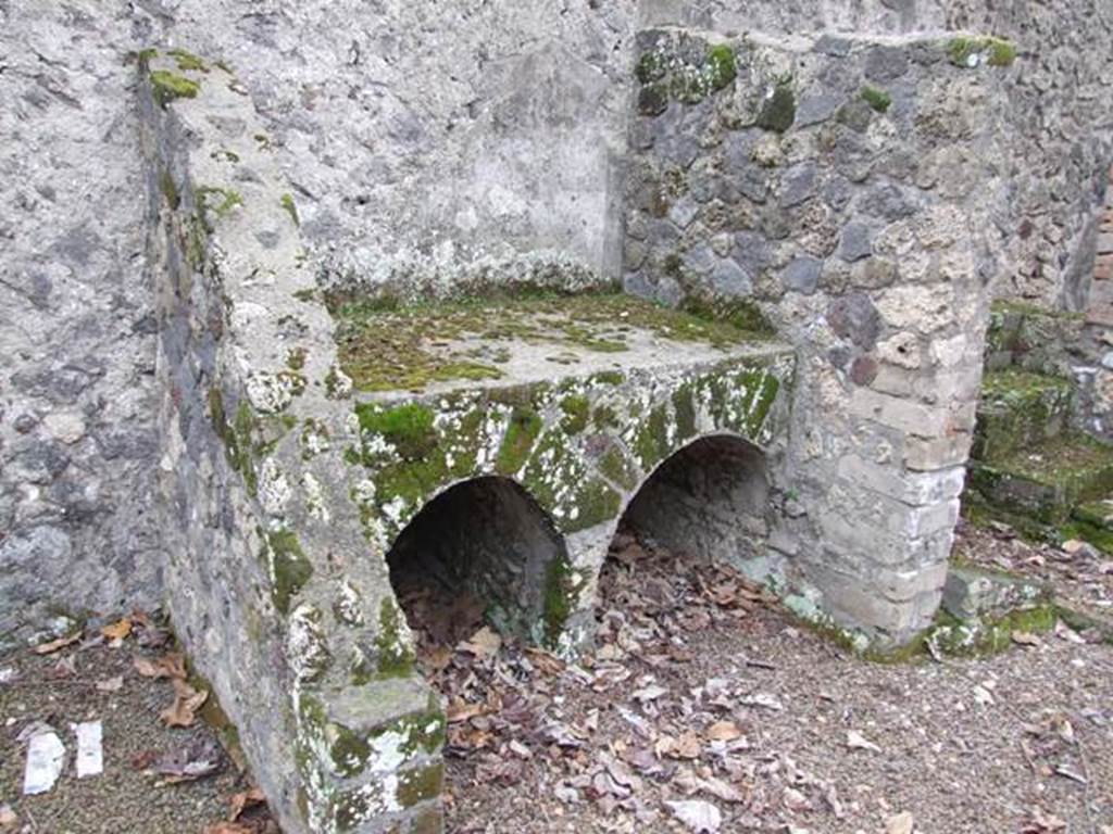 II.8.2. Thermopolium. December 2007. Bench or hearth on south wall.