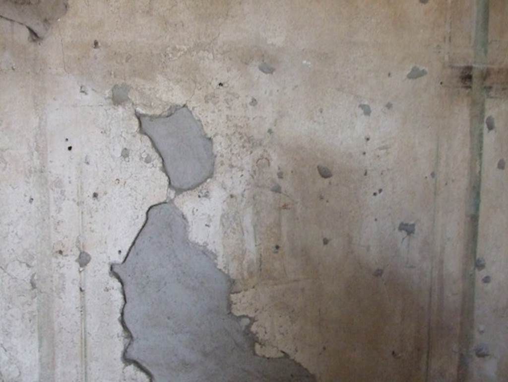 II.9.1 Pompeii. December 2007.
Remains of two painted figures in centre of west wall in room 5 with large window on south side behind atrium.