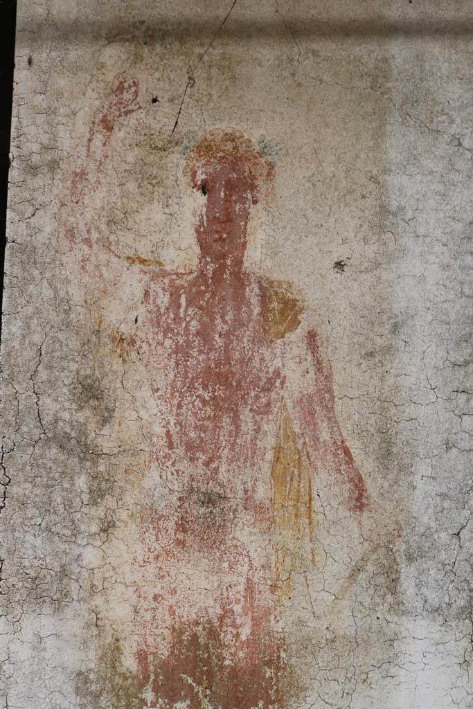 II.9.1 Pompeii. December 2018.
Detail of painting of Bacchus on south face of column on the north side of the triclinium 8.
Photo courtesy of Aude Durand.